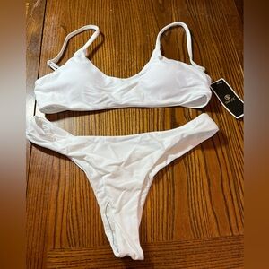SHERRY DC WHITE BIKINI. NWT. SIZE MEDIUM
